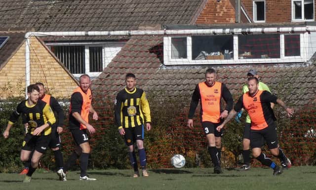 North Wingfield WMC [salmon] beat Hasland Community 4-0 in Division Five. Pic by Martin Roberts.