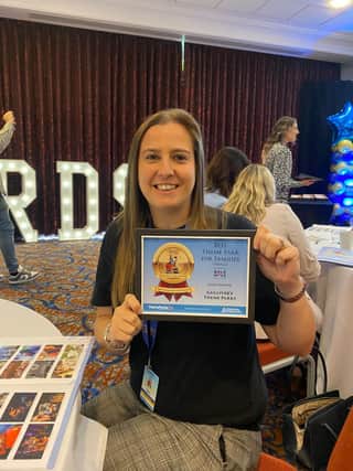Hannah Marsden, resort manager at Gulliver’s Kingdom, with a national theme park award for Gulliver’s.