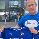 Adam Croser pictured with the signed Chesterfield FC shirt he hopes to give away to a young Spirite.