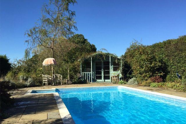 The property boasts an outdoor heated swimming pool, which has its own pool house.