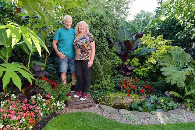 Richard and Sharon Smithson in their 'tropical' garden.