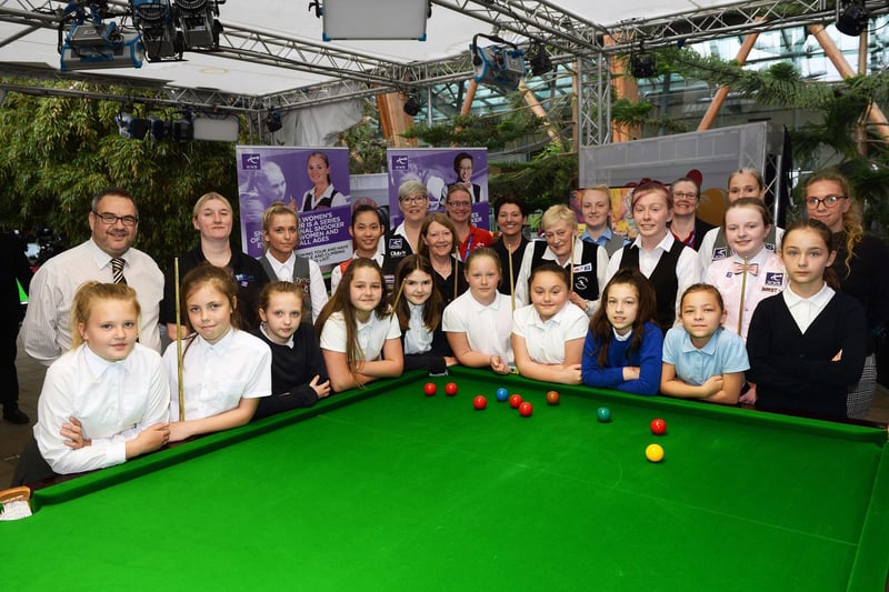 The kids from Spire Junior School get top tips at a Snooker Womens Day event at Sheffield Winter Garden.