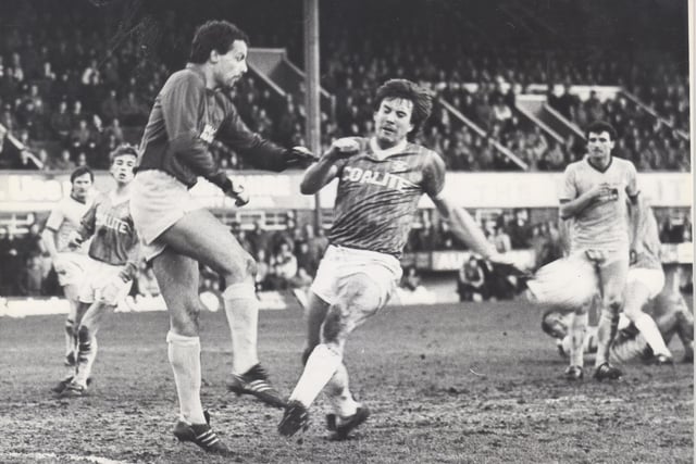 Bury keeper Brown blocks a Bob Newton shot during Chesterfield's match with them on 2nd Feb 1985.