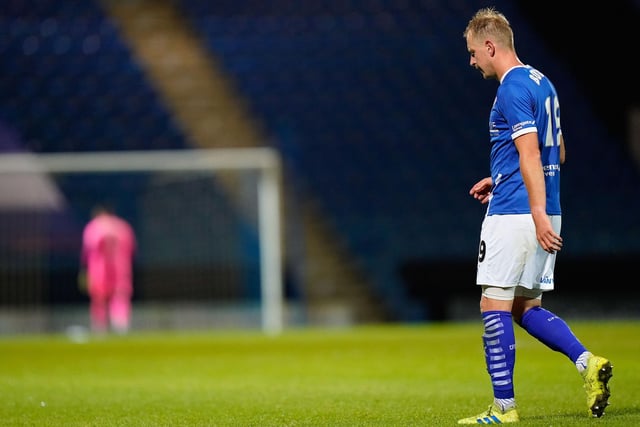 Chesterfield's Scott Boden walks off the pitch after getting a red card.