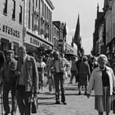 A packed Chesterfield High Street in 1988 with crowds outside the former Marks and Spencer.