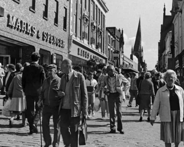A packed Chesterfield High Street in 1988 with crowds outside the former Marks and Spencer.