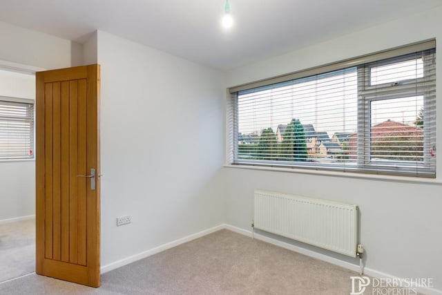 All three bedrooms are extremely well finished and presented. This one faces the back of the property, while the third features a handy over-stairs storage cupboard.