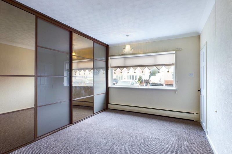 Master bedroom with a range of fitted wardrobes
