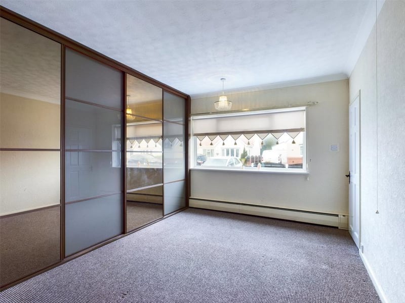 Master bedroom with a range of fitted wardrobes