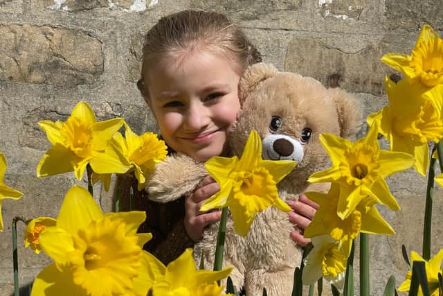 Eliza Brysz with springtime daffodils in Bolsover on Saturday.