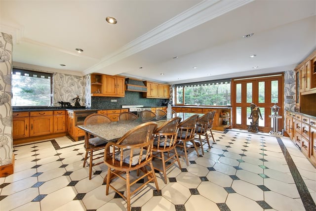 Any cook would be proud to prepare and serve  meals in this beautiful dining kitchen which boasts solid oak fitted units with  granite worktops and is large enough to accommodate a table of ten people comfortably.
