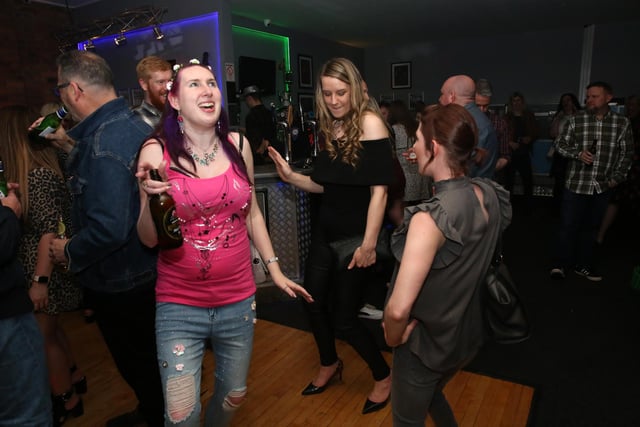 The photographer captured revellers off-guard on a corner of the dancefloor.