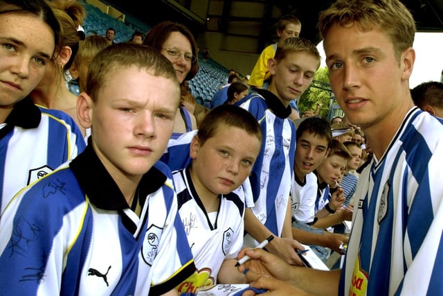 Wednesday star Steven Haslam signs autographs for fans in August 2001.
