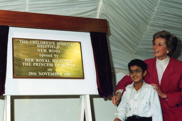 HRH Princess Diana is shown unveiling a plaque to mark the opening of a new wing at the hospital with 11-year-old Omar Khan, on November 29, 1989.