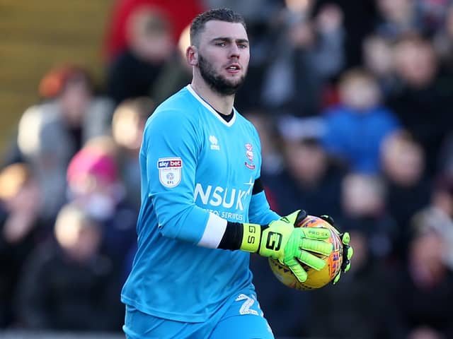 Grant Smith, pictured playing for Lincoln City, has signed for Chesterfield.