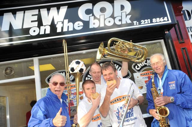 The Pukka Pies-sponsored England Band outside New Cod On The Block at Commonside, Sheffield.