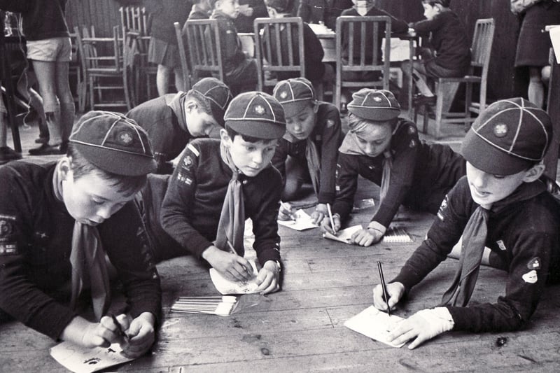 Testing their abilities against each other were the Chesterfield and District Cub Scouts at their annual contest held at the Trinity Institute.  Picture shows members of the 3rd Brampton Pack as they get down on the floor to do sketching in one of the events on October 10 1970
