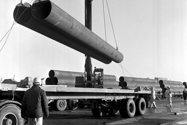 Pipes for the British Petroleum (BP) North Sea Oil pipeline are unloaded at Leith docks in November 1972.