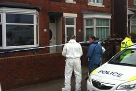 Forensics officers outside Julie's home in Station Road following the discovery of the bodies.
