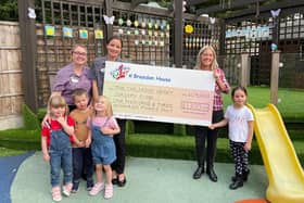 L-r: Alice, Luke and Giorgia, Natalie Fearn, early years teacher, Nicola Taylor, nursery manager, with fundraiser Jodie Cassidy and her daughter.