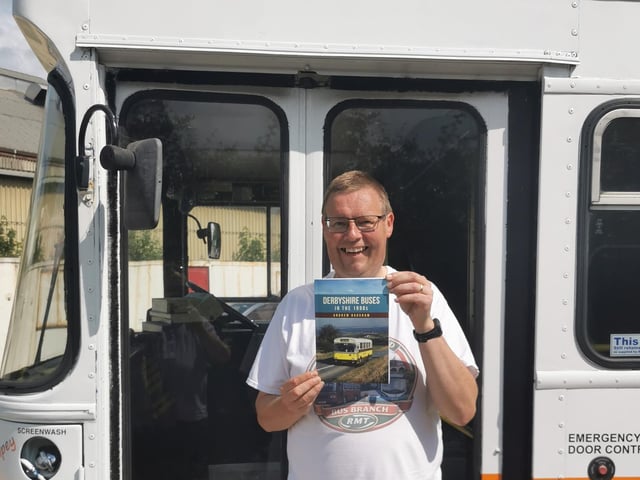 Andrew Bagshaw holding a first edition copy next to a lovingly restored heritage Stagecoach bus, now owned by Adam Lowings, pictured at the 2026 Derbyshire Dales road and rail rally held each year at the Peak Rail Rowsley South show ground.