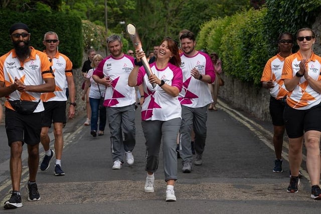 Cheers as the baton moves through Bakewell. Pic: Simon Beynon/Derbyshire Dales District Council.