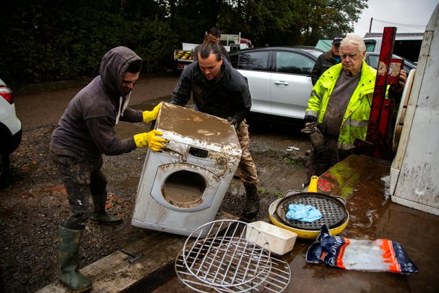 Residents at Tapton Terrace take on the heartbreaking task of clearing items from the home ruined by the floods