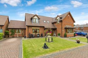 The property is described as an 'extended, five-bedroom, detached family home on gated development'.