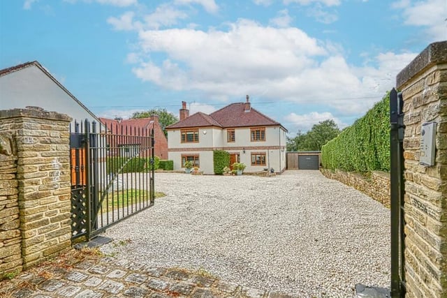 The property at Longedge Lane, Wingerworth is set behind gates and has a large driveway with parking space for up to 10 vehicles.