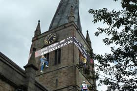 Edited pictures showed how the 'climbers' would have looked scaling the Crooked Spire. Photo: XR Chesterfield and NE Derbyshire.