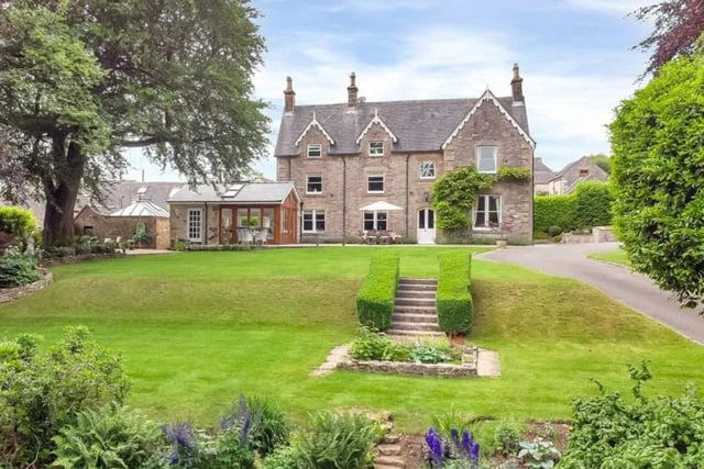 Complete with five bedrooms and over five acres of land, this detached property has an asking price of £1,600,000.
