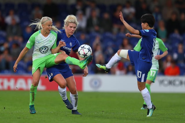 Pernille Harder of Wolfsburg tackles Chelsea's Bright during the UEFA Womens Champions League semi-final, first leg between Chelsea Ladies and Wolfsburg in 2018.