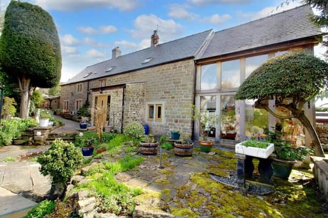 The cottage on Bull Lane, Matlock, offers spacious accommodation and extensive gardens.