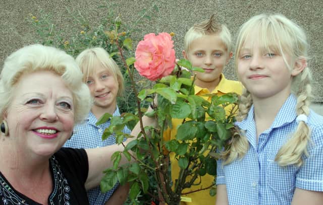 Hady School said goobye to teacher Judith Sensecall, who retired after 32yrs. Pictured with her rose in the Chesterfield in Bloom garden are Lauren Andrews 10yrs. Kyle Perrins 10yrs and Katherine Andrews 10yrs.