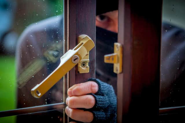 A thief stole bank cards and cash from an elderly Derbyshire man as part of a distraction burglary last week.