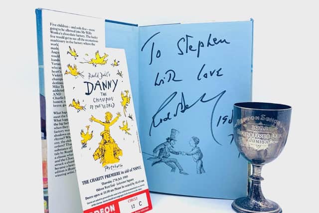 The lot includes a signed copy of Charlie and the Chocolate Factory signed 'To Stephen, with love, Roald Dahl, 1989', and a ticket for the premiere of Danny the Champion of the World, Odeon, West End, July 27, 1989.
