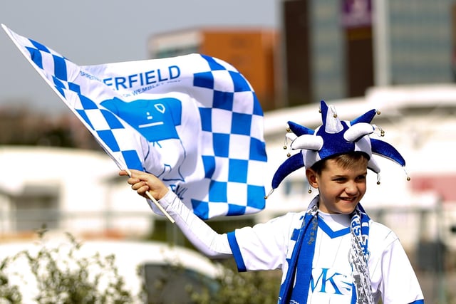 A young Chesterfield fan waves a flag prior to the Johnstone's Paint Trophy Final between Chesterfield and Peterborough United at Wembley Stadium in 2014.