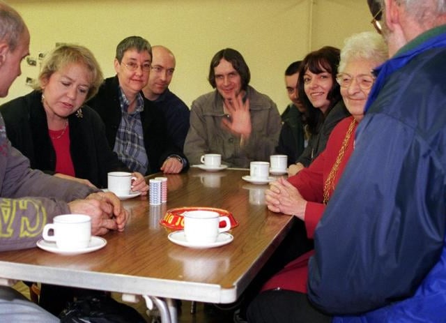 To mark the national homeless day a special Sunday Cafe for the homeless was held at St Peters Church in Chains in 2000. Rosie Winterton photographed speaking with visitors.