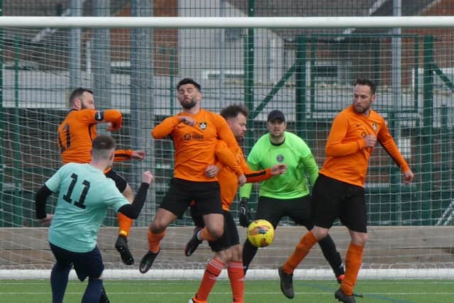 Action from Rangers' (tangerine) win over Brampton Victoria. All photos by Martin Roberts.