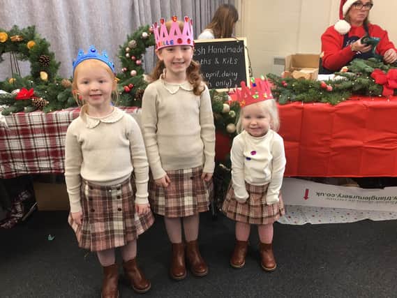 Young visitors at Bakewell Christmas Sparkle wearing their handmade crowns.