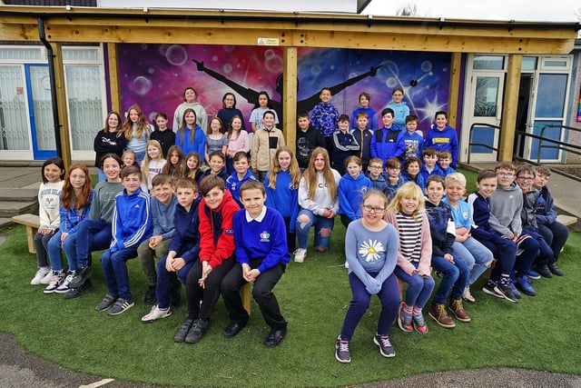 Inkersall Spencer Academy says goodbye to the pioneering panthers and the trailblazing tigers class. Children are pictured dressed in blue to raise money for autism awareness week, Light it up Blue.