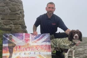 Daniel Hoole pictured with his sidekick Buddy at the top of Mam Tor during their fundraising challenge for Phoenix Heroes