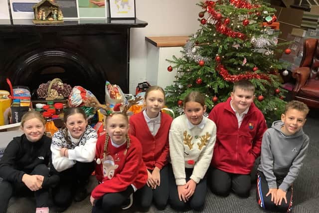 House and Vice Captains at Highfield Hall Primary School with their donations