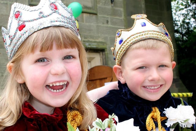 Millie Smith, 3, and Samuel Dealtry, 5, are crowned Ashover May Day carnival's queen and king.