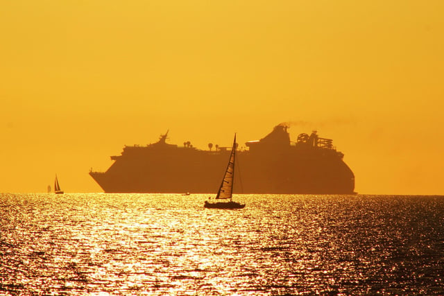 Royal Caribbean's Independence of the Seas navigating around the Bramble bank in a beautiful Autumn sunset, taken from Lee On the Solent a few years back.