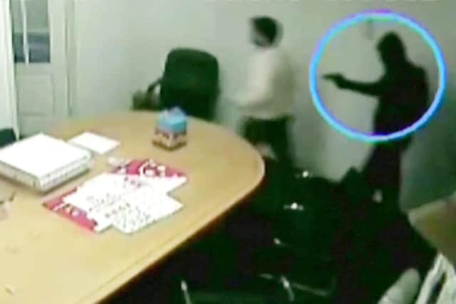 A CCTV image of the horrifying moment masked raiders ambushed a cash and carry - just minutes before they tied up the staff and shot the company director, Akhtar Javeed, at point blank range.