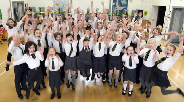 Walton and Holymoorside school choir celebrate getting to the finals of the Barnardo's National choir competition in 2012