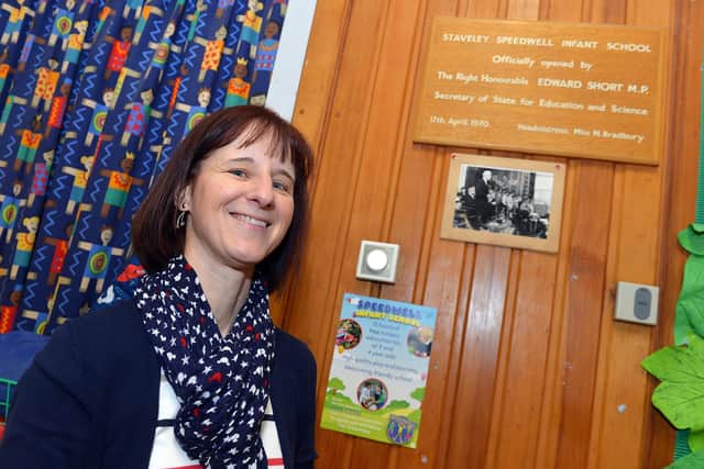 Speedwell Infant School headteacher Jane Moore with the original plaque for the school's opening in 1970.