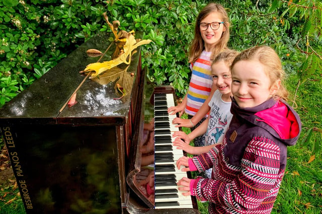 Having fun at the outdoor piano in the Mulberry Garden... Lto R Evie Cooper, Phoebe Brown, Freya Brown