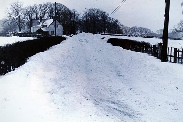Snow drifts on Coach Road, Ripley 1979